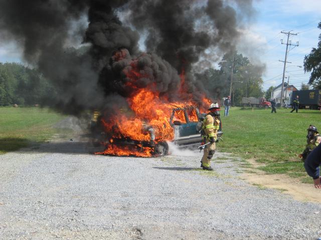 Lieutenant Brian Slauch prepares his crew for a car fire on University Road.